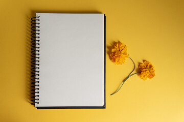 notebook with yellow flowers