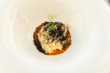 Cod fish puree with black salt gourmet starter in restaurant