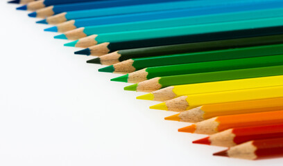 A row of colorful pencils on white background