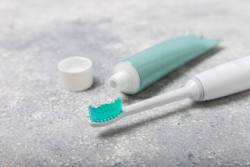 Toothbrush and tube of toothpaste on marble background with copy space. Flat lay. Oral hygiene. Oral Care Kit. Dentist concept. Place for text. Place to copy.