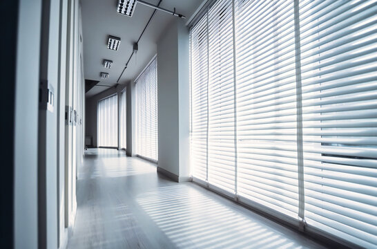 white wooden blinds in white office