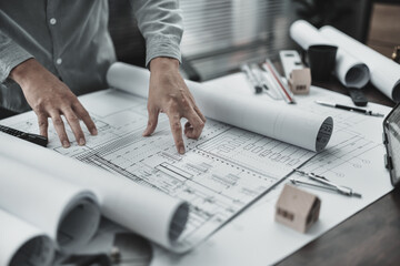 Architect engineer read drawing design working on blueprint. House planning design and construction...