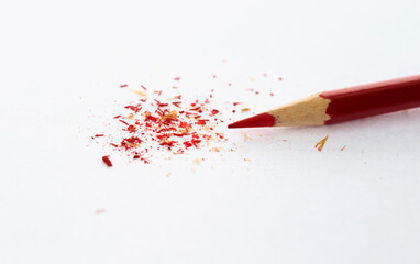 Blue pencil and sawdust on white background - Powered by Adobe