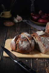 A loaf of rye bread in low key