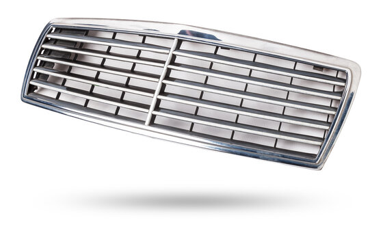 radiator grille on a white background made of shiny chromed metal is an element of the car body that protects and passes air to the engine. Design element and tuning replacement in the workshop.
