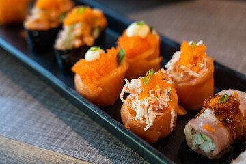 Salmon roll with crab stick and tobiko