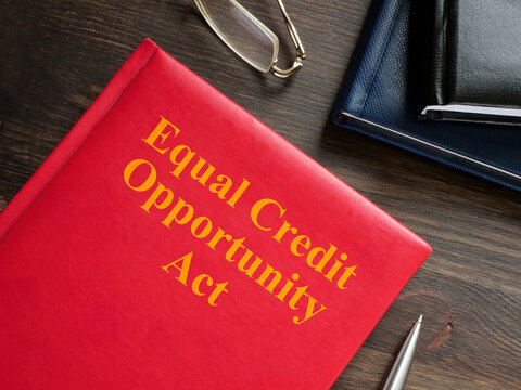 Equal Credit Opportunity Act ECOA book near glasses and pen.