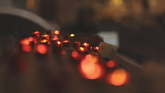 Red blurry light from small candles - bokeh effect