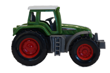 green toy tractor isolated on white