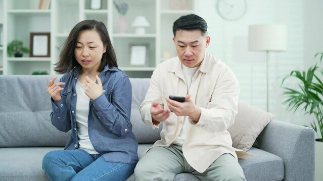 An angry, jealous husband suspects his wife of infidelity. A mad man grabbed a smartphone from a woman's hands, reads her private messages, quarrels with her. Conflict and crisis in family relations
