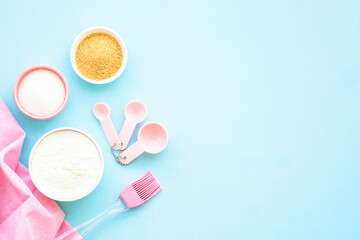 Food baking background. Ingredients for cooking at blue. Flat lay with copy space.
