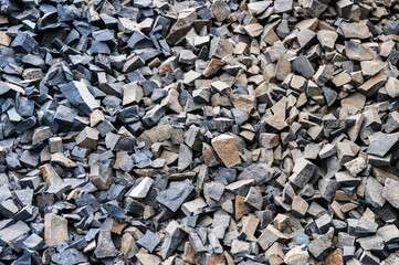 Large gray granite gravel background. Rubble as a background. Building stone.