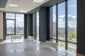 Fototapeta na wymiar empty modern hall room with columns, doors and panoramic windows.