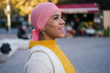 Woman with cancer smiling and fighting the disease. Concept: fight, illness, bravery