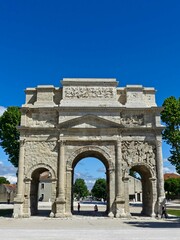 Fototapeta na wymiar Orange, May 2023 : Visit the beautiful city of Orangeen Provence - Historical city with its arena and ancient theater - View on the triumphal arch