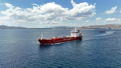 Aerial drone photo of small oil chemical tanker cruising near port of Piraeus, Saronic gulf,...
