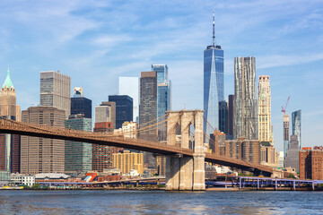 New York City skyline of Manhattan with Brooklyn Bridge and World Trade Center skyscraper in the...
