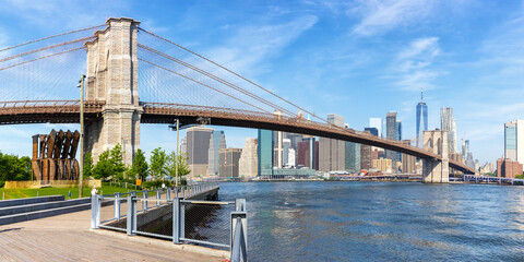 New York City skyline of Manhattan with Brooklyn Bridge and World Trade Center skyscraper panorama...