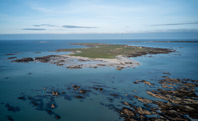 Aerial photograph captures the serene beauty of Finish Island (Oileán Finis) in Galway County, Ireland. 