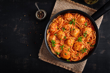 Spaghetti pasta with meatballs in tomato sauce. Italian pasta. Top view, flat lay