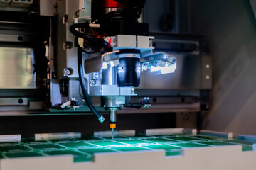 PCB separator at factory, process of separation of printed circuit boards. Automated technology, industrial, robotic, electronic, production, manufacturing concept