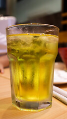 Japanese green tea or Ocha tea or yellow drink tea served in a tall glass. Ryokucha Japanese tea.