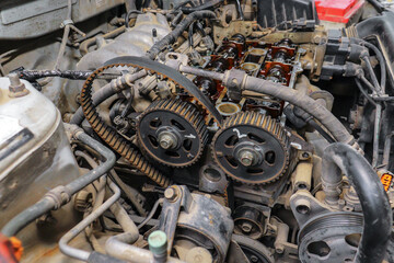 Fototapeta premium Repair of an old car engine. Replacement of a torn timing belt.