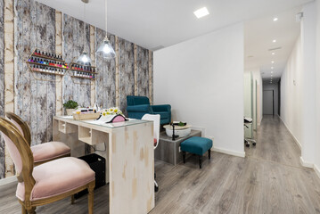 A beauty salon with booths to groom the clients' nails