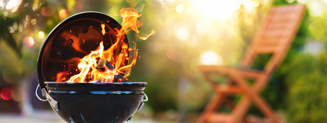 Barbecue grill with fire on open air - obrazy, fototapety, plakaty