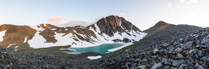 Paddy Peak in northern arctic area during summer time with glacial lake below a stunning rock...