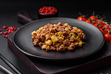 Tasty dish consisting of zucchini, beef meat, mushrooms, onions and garlic