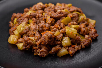 Tasty dish consisting of zucchini, beef meat, mushrooms, onions and garlic