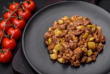 Tasty dish consisting of zucchini, beef meat, mushrooms, onions and garlic