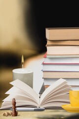 Stack of old vintage books and cup of tea