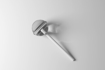 Round monochromatic lollipop candy with a stick on white background with shadow. Illustration of the concept of childhood and confectionary industry
