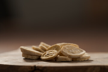 freeze dried banana chips on olive board