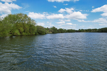 High Angle View Caldecotte Lake which is Located at Milton Keynes City of England Great Britain, The Footage Was Captured on 21-5-23 During Warm Sunny Day over UK.