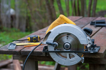 Circular saw for wood, side view, carpenter's tools