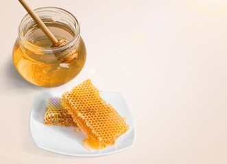 Tasty sweet honey jar and dipper on the desk