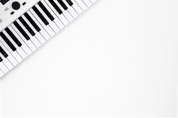 Fototapeta na wymiar Synthesizer on a white background, midi keyboard isolated, minimalism, copy space.