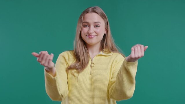 Woman asks join her, beckons with inviting hand hugs gesture. Hey you, come on
