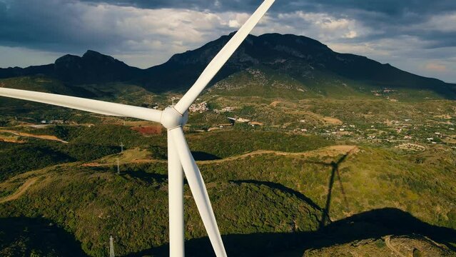 Wind turbine on windless day. Wind turbine blades stopped turning. loosing energy concept