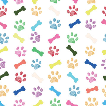 Rainbow colors paw prints and bone. Seamless fabric design pattern