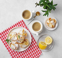 Soffioni - traditional ricotta cheese and lemon cakes. Concept of sweet and easter national pastries. Breakfast concept, top view