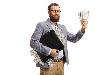 Bearded man holding a briefcase and stacks of money