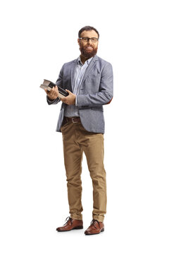 Full length shot of a bearded man posing and holding books