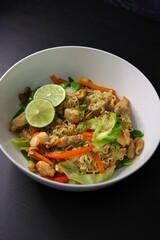Pancit Canton Chow Mein Stir Fry Instant Noodles with Shrimp, Chicken, Cabbage, Carrots, Snow Peas, Red Peppers, Lime