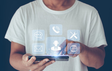 Technical Support Center Customer Service Internet Business Technology Concept. Person hand using smartphone with virtual screen support customer icon, it support, call center, customer service help.