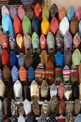 Traditional arabic style loafers of colors in the streets of the Marrakech Medina in Morocco