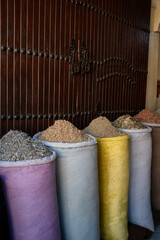 Spices in colorful bins in a store in the streets of the Marrakech Medina in Morocco